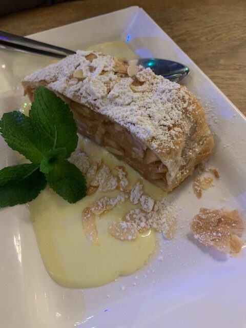 apple strudel or apfelstrudel in a German beer hall